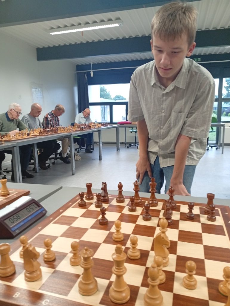May be an image of 5 people and chess